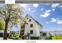 Mehrfamilienhaus mit großzügigem Grundstück und Gewerbeflächen in Neu-Isenburg