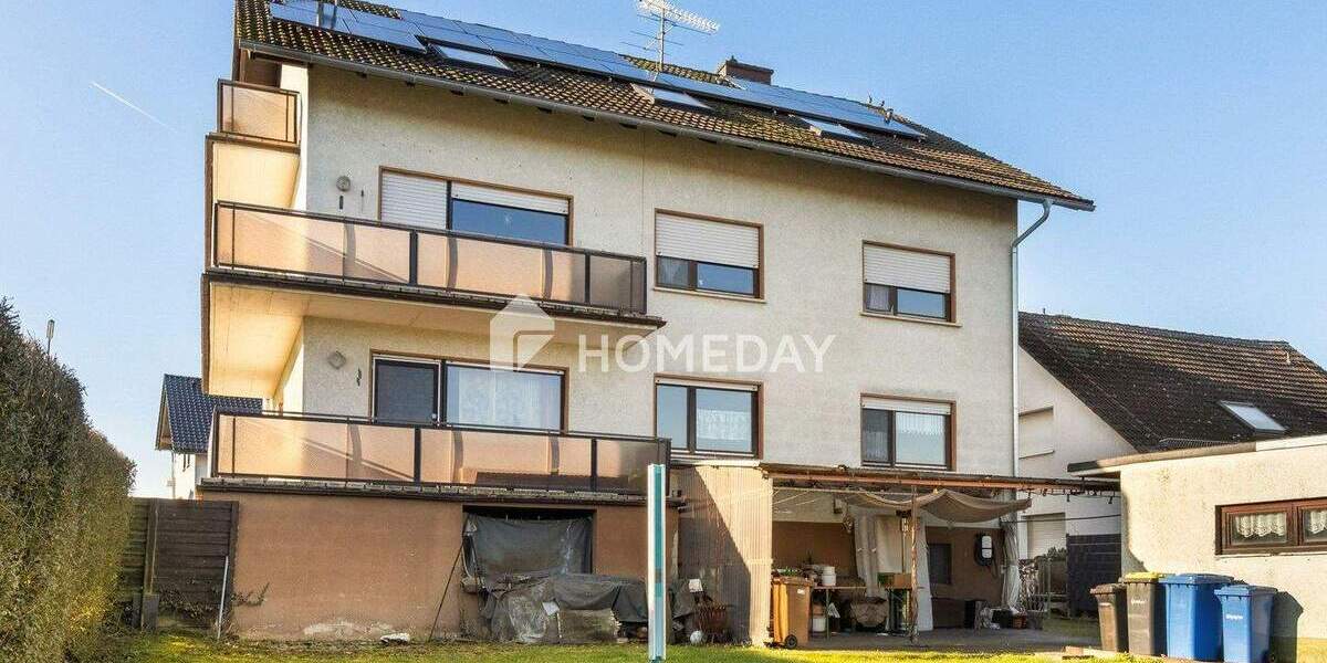 Gepflegtes MFH mit PV, Wallbox, Garagen, Balkonen & Ausbaupotenzial in ruhiger Lage 1 zimmer