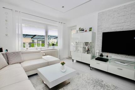 Top-modernisierte 3-Zimmerwohnung mit Gartenanteil und Garage
